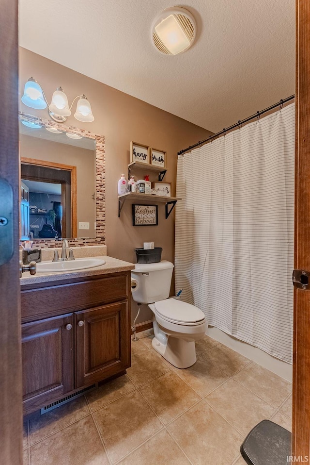 12 Chrysler Ave, Wabash, IN 46992 - bathroom featuring vanity, tile patterned floors, curtained shower, and a textured ceiling
