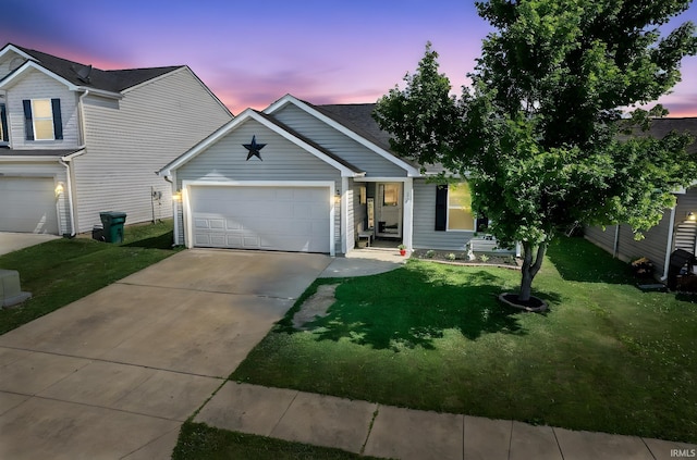 274 Chapelhill Dr, Lafayette, IN 47905 - view of front facade featuring driveway, a yard, and an attached garage