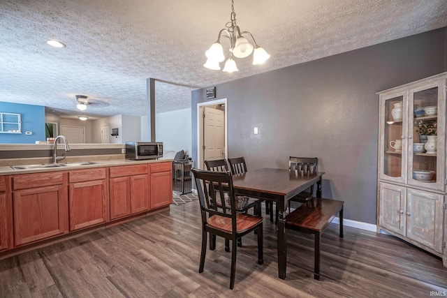 274 Chapelhill Dr, Lafayette, IN 47905 - dining room featuring a textured ceiling, dark wood-style floors, and a chandelier