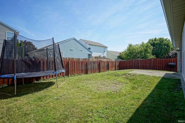 274 Chapelhill Dr, Lafayette, IN 47905 - fenced backyard featuring a trampoline and a patio