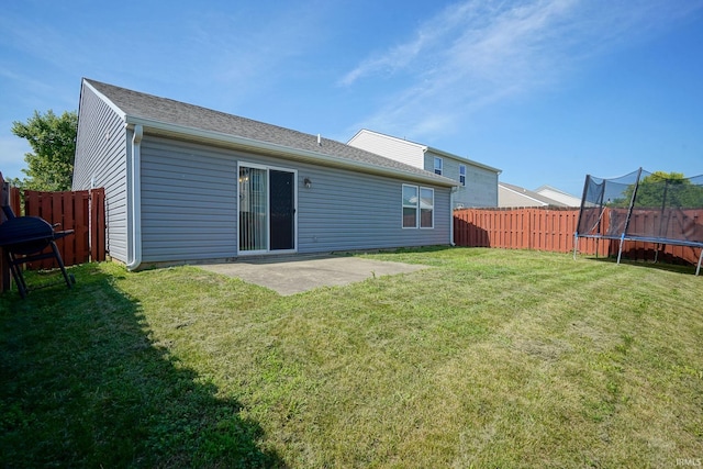 274 Chapelhill Dr, Lafayette, IN 47905 - rear view of house featuring a trampoline, a fenced backyard, and a patio area