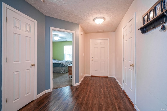 274 Chapelhill Dr, Lafayette, IN 47905 - hallway featuring dark wood-style floors and a textured ceiling
