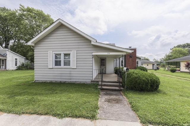 204 N Main St, Kennard, IN 47351 - bungalow featuring a front lawn
