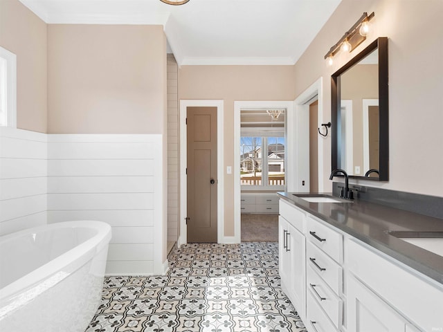 13092 Hallux Cv, Fort Wayne, IN 46845 - bathroom featuring double vanity, a freestanding tub, and crown molding
