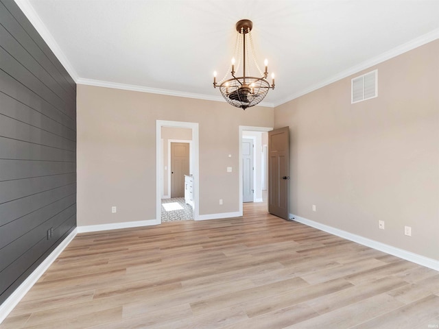 13092 Hallux Cv, Fort Wayne, IN 46845 - empty room featuring a chandelier, ornamental molding, and light wood finished floors