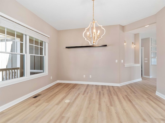 13092 Hallux Cv, Fort Wayne, IN 46845 - spare room with wood finished floors and a chandelier
