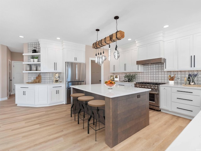 13092 Hallux Cv, Fort Wayne, IN 46845 - kitchen with stainless steel appliances, open shelves, tasteful backsplash, light wood-type flooring, and recessed lighting