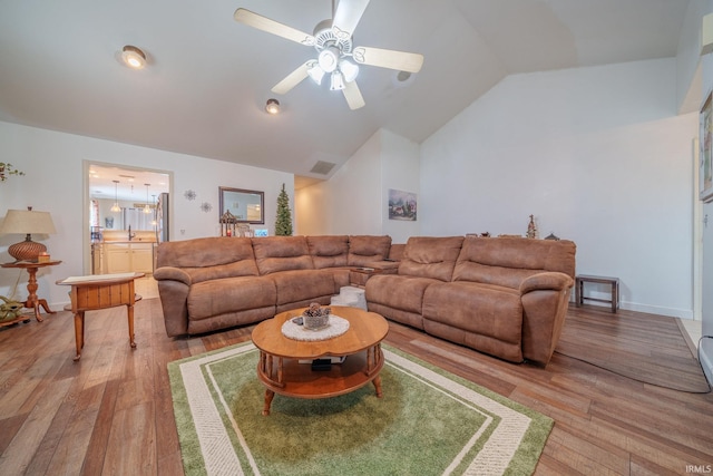 1510 W Crane Pond Dr, Marion, IN 46952 - living room featuring vaulted ceiling, light wood finished floors, and a ceiling fan