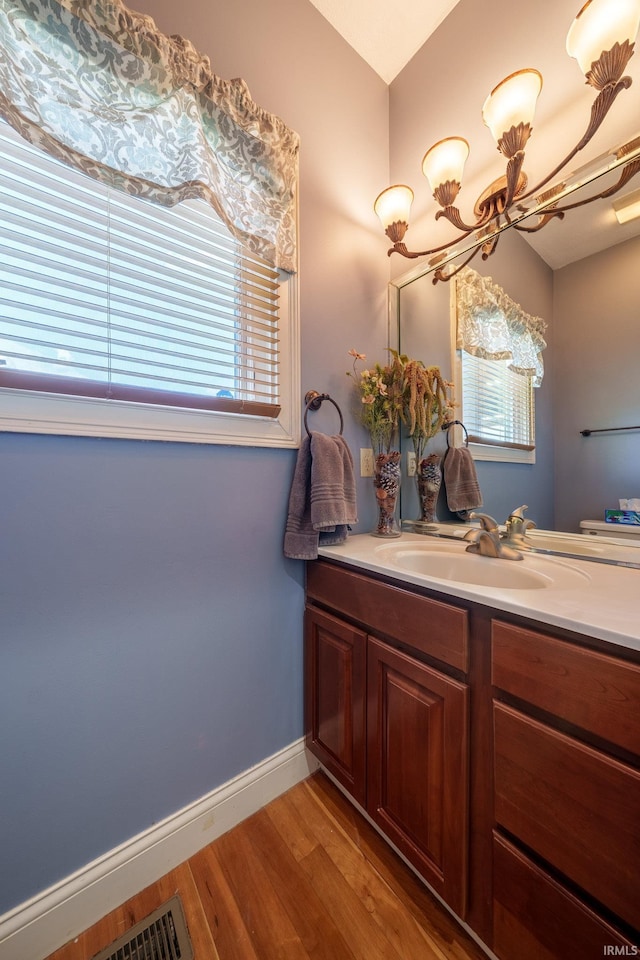 2220 Meadowbrook Dr, Marion, IN 46952 - bathroom with vanity and wood finished floors