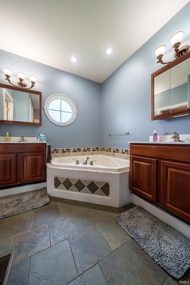 2220 Meadowbrook Dr, Marion, IN 46952 - full bath featuring vanity, a garden tub, recessed lighting, and stone tile floors