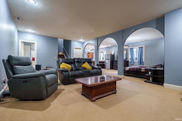 2220 Meadowbrook Dr, Marion, IN 46952 - carpeted living room featuring arched walkways and stairs