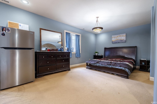 2220 Meadowbrook Dr, Marion, IN 46952 - bedroom with freestanding refrigerator and light colored carpet