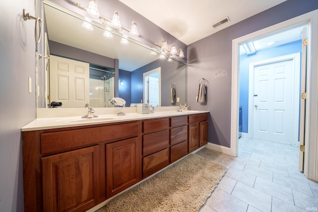 2220 Meadowbrook Dr, Marion, IN 46952 - full bath with double vanity, a shower with shower door, and tile patterned floors