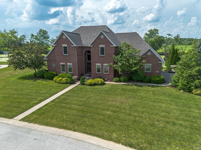 2220 Meadowbrook Dr, Marion, IN 46952 - view of front facade with brick siding, a front yard, and roof with shingles
