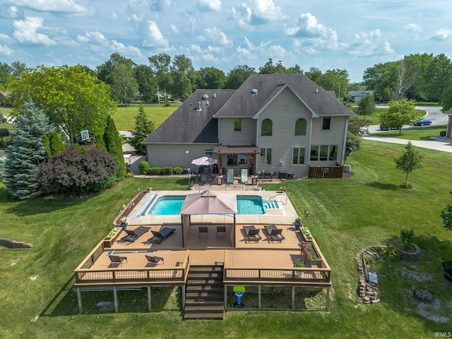 2220 Meadowbrook Dr, Marion, IN 46952 - rear view of house with a deck, outdoor dining space, a lawn, an outdoor pool, and a patio area