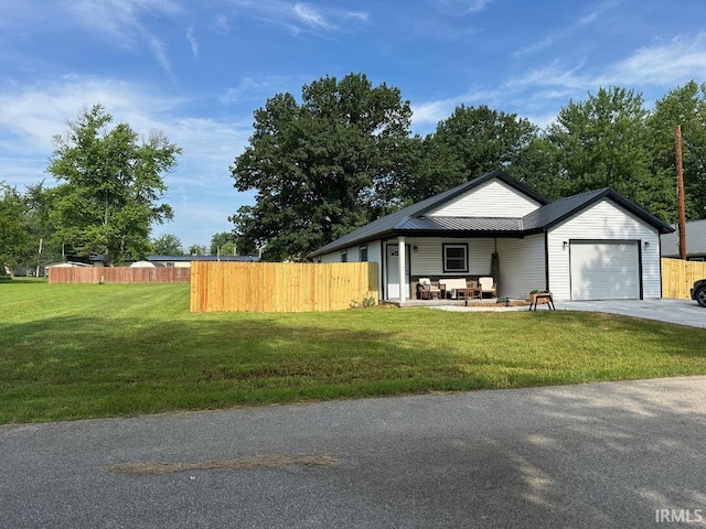 148 SW 8th St, Linton, IN 47441 - view of front facade with an attached garage and concrete driveway