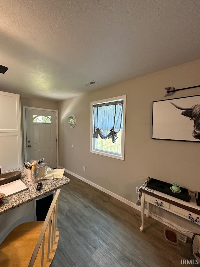 148 SW 8th St, Linton, IN 47441 - interior space with a textured ceiling and dark wood finished floors