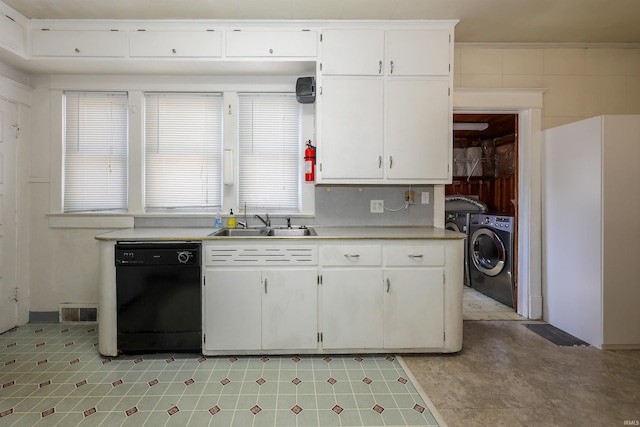 617 S Indiana Ave, Auburn, IN 46706 - kitchen with dishwasher, washer / clothes dryer, white cabinets, light countertops, and light flooring