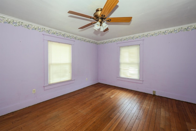 617 S Indiana Ave, Auburn, IN 46706 - empty room with plenty of natural light, wood-type flooring, a ceiling fan, and ornamental molding