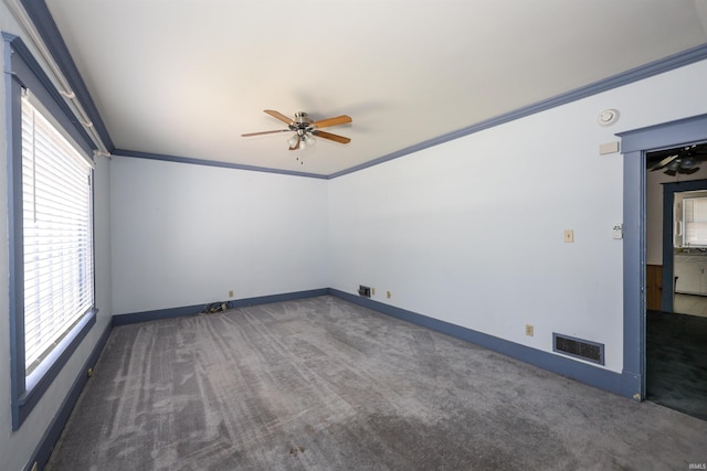 617 S Indiana Ave, Auburn, IN 46706 - empty room with ceiling fan, carpet flooring, healthy amount of natural light, crown molding, and a smoke detector