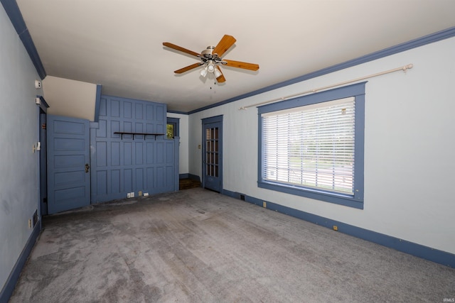 617 S Indiana Ave, Auburn, IN 46706 - unfurnished bedroom with carpet, crown molding, and a ceiling fan