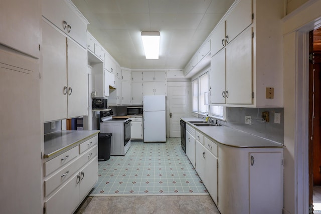 617 S Indiana Ave, Auburn, IN 46706 - kitchen with white appliances, light flooring, and white cabinets