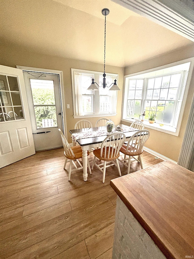 960 A St NE, Linton, IN 47441 - dining room featuring a chandelier, healthy amount of natural light, and hardwood / wood-style flooring