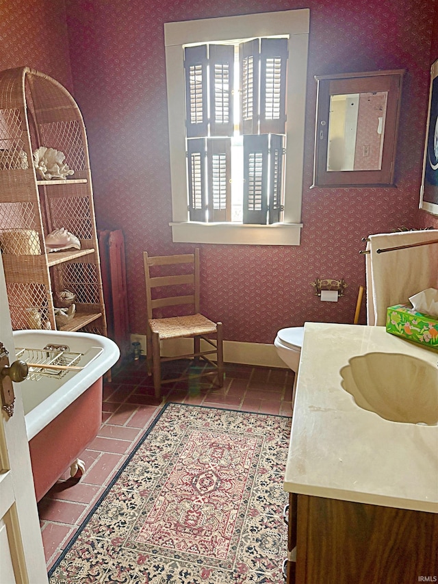 960 A St NE, Linton, IN 47441 - full bathroom featuring a freestanding tub, wallpapered walls, vanity, and tile patterned floors