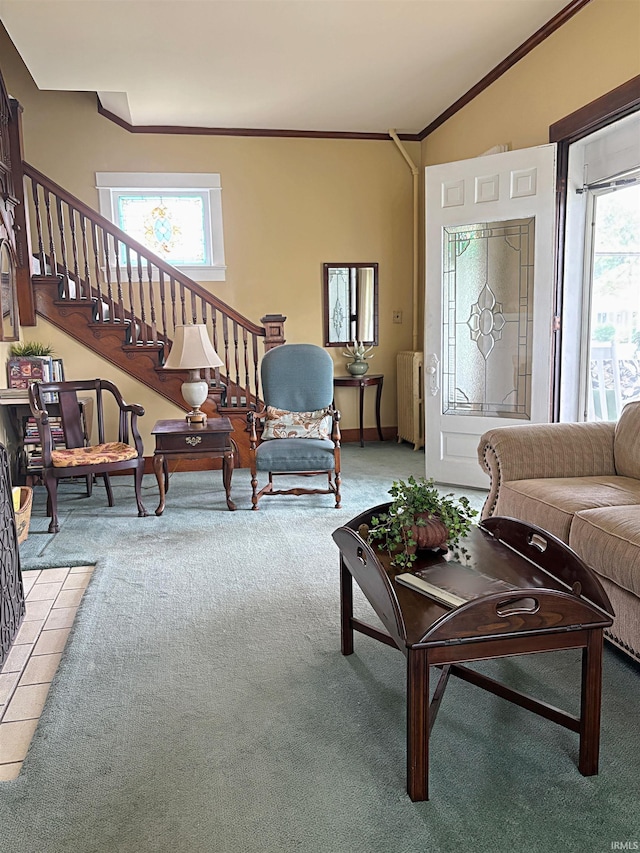 960 A St NE, Linton, IN 47441 - living room featuring radiator heating unit, light carpet, stairway, and ornamental molding