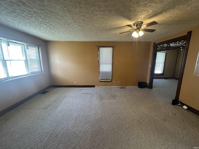 448 N 7th St, Mitchell, IN 47446 - carpeted spare room with a textured ceiling and ceiling fan