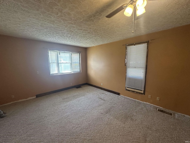 448 N 7th St, Mitchell, IN 47446 - empty room with carpet flooring, a textured ceiling, and ceiling fan