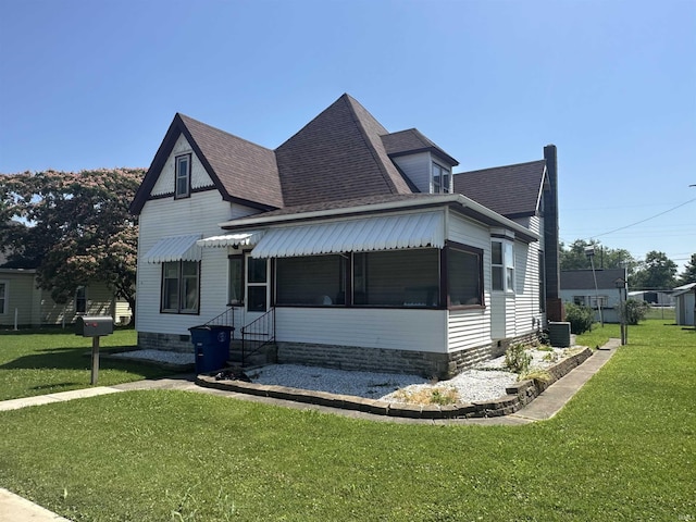 448 N 7th St, Mitchell, IN 47446 - view of front of property featuring a front yard, roof with shingles, and entry steps