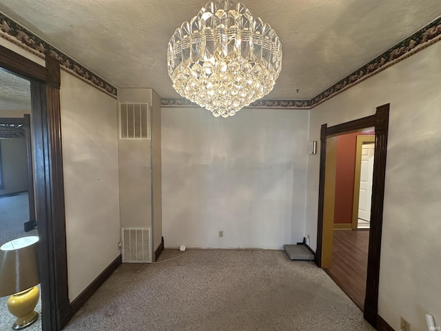 448 N 7th St, Mitchell, IN 47446 - carpeted empty room featuring a chandelier and a textured ceiling