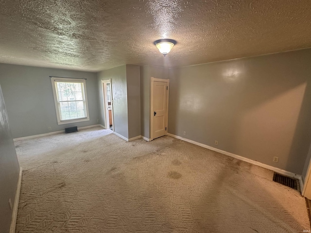 448 N 7th St, Mitchell, IN 47446 - unfurnished room featuring a textured ceiling and light colored carpet
