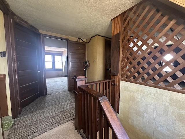 448 N 7th St, Mitchell, IN 47446 - hall with an upstairs landing, carpet, and a textured ceiling