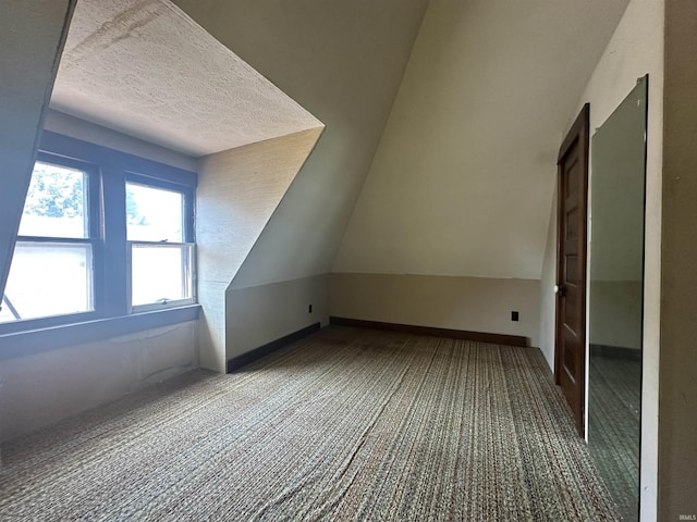 448 N 7th St, Mitchell, IN 47446 - additional living space with carpet flooring and a textured ceiling