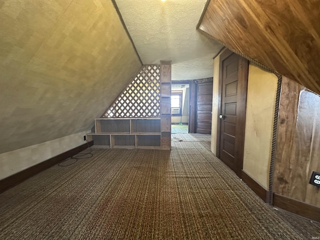 448 N 7th St, Mitchell, IN 47446 - additional living space featuring a textured ceiling, carpet flooring, and vaulted ceiling