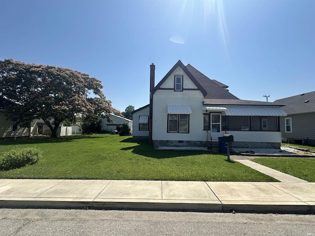448 N 7th St, Mitchell, IN 47446 - victorian-style house featuring a front lawn and a chimney