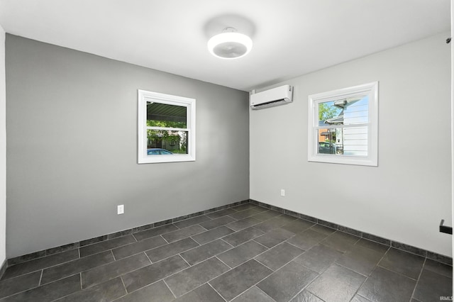 1914 Emerson Ave, Fort Wayne, IN 46808 - spare room featuring a wall mounted AC and baseboards