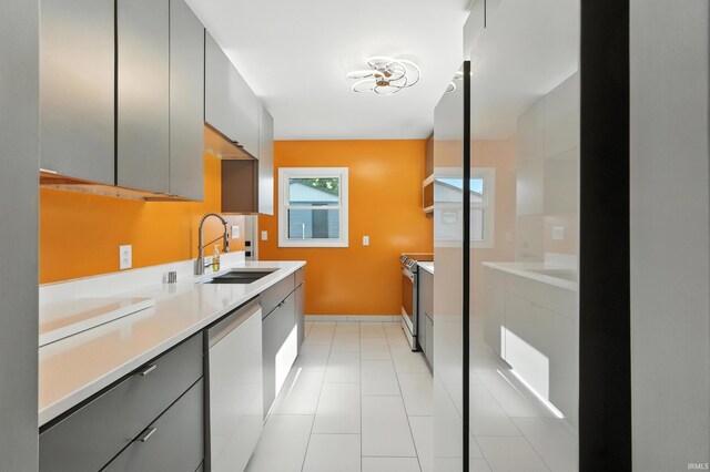 1914 Emerson Ave, Fort Wayne, IN 46808 - kitchen with stainless steel appliances, gray cabinetry, light countertops, and modern cabinets