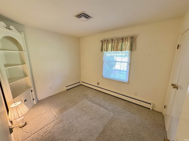 3105 Perrysburg Rd, Logansport, IN 46947 - carpeted spare room featuring a baseboard heating unit