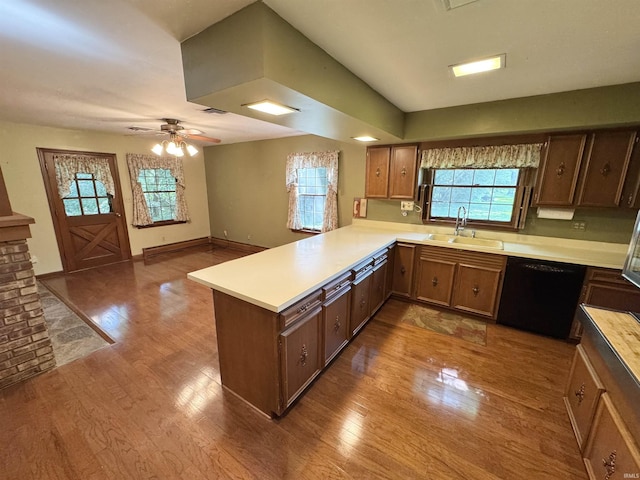 3105 Perrysburg Rd, Logansport, IN 46947 - kitchen with dishwasher, a peninsula, wood finished floors, light countertops, and ceiling fan