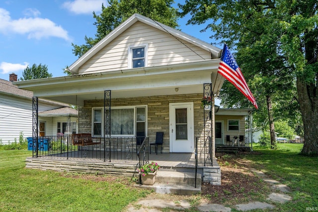 1331 Summit St, New Haven, IN 46774 - view of front facade with a porch, stone siding, and a front yard