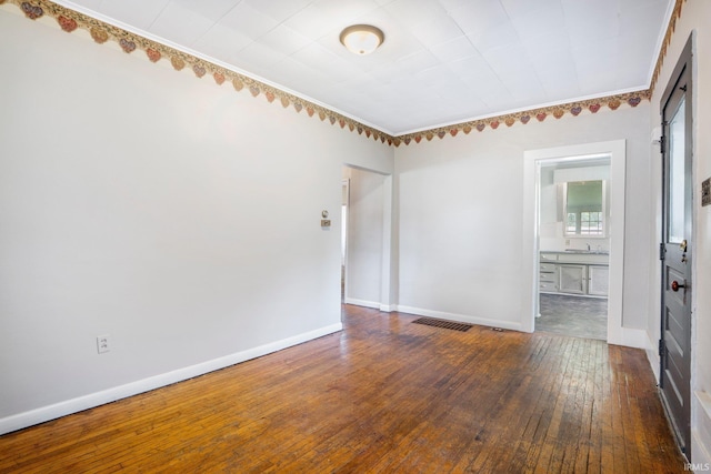 1331 Summit St, New Haven, IN 46774 - spare room with hardwood / wood-style flooring and crown molding