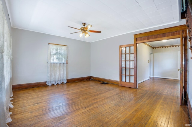 1331 Summit St, New Haven, IN 46774 - empty room with a ceiling fan, hardwood / wood-style flooring, ornamental molding, and french doors