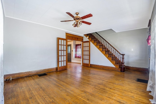 1331 Summit St, New Haven, IN 46774 - unfurnished living room with a ceiling fan, hardwood / wood-style floors, french doors, crown molding, and stairway