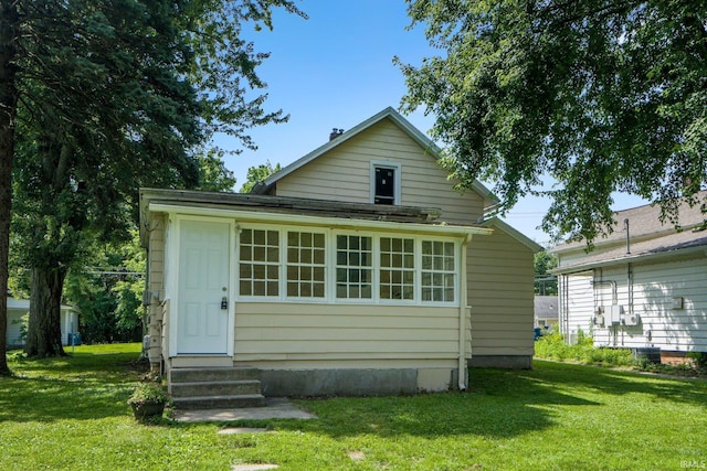 1331 Summit St, New Haven, IN 46774 - back of house featuring a lawn and entry steps