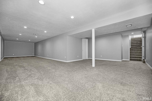 58155 Beehler Rd, Osceola, IN 46561 - finished basement featuring recessed lighting, carpet flooring, stairway, and a textured ceiling