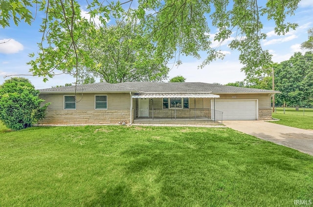 58155 Beehler Rd, Osceola, IN 46561 - ranch-style house with concrete driveway, stone siding, an attached garage, and a front yard