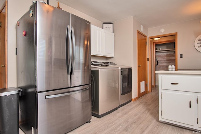 1401 S M St, Elwood, IN 46036 - washroom featuring washing machine and dryer and light wood-style floors